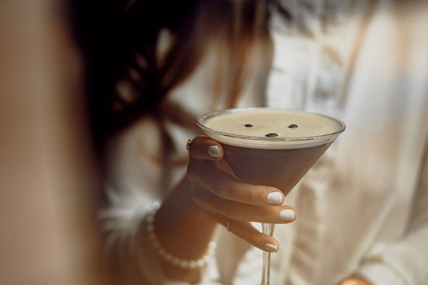 Someone holds an espresso martini